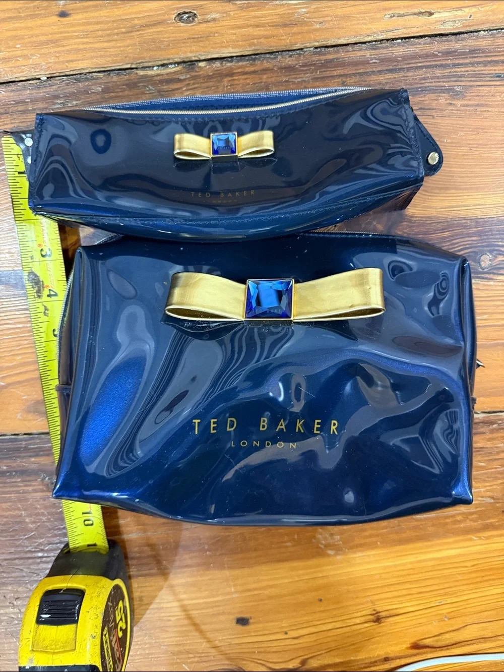 Ted Baker Navy Patent Cosmetic Pouch Set with Gold Bow and Blue Gem